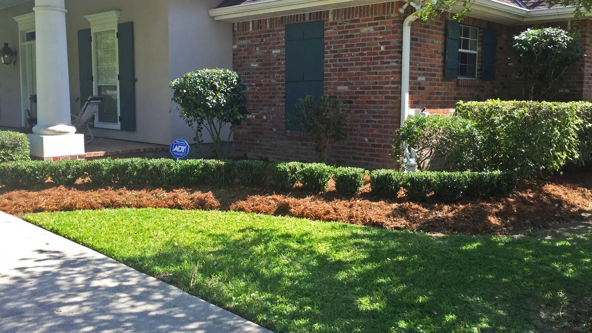 Beautifully maintained landscaping with new mulch at a residential property.